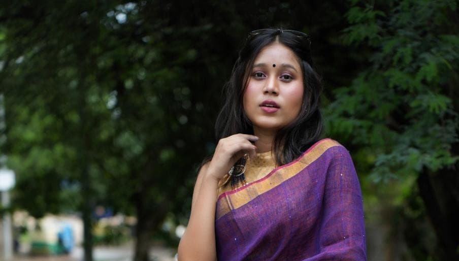 Woman in elegant saree with sunglasses