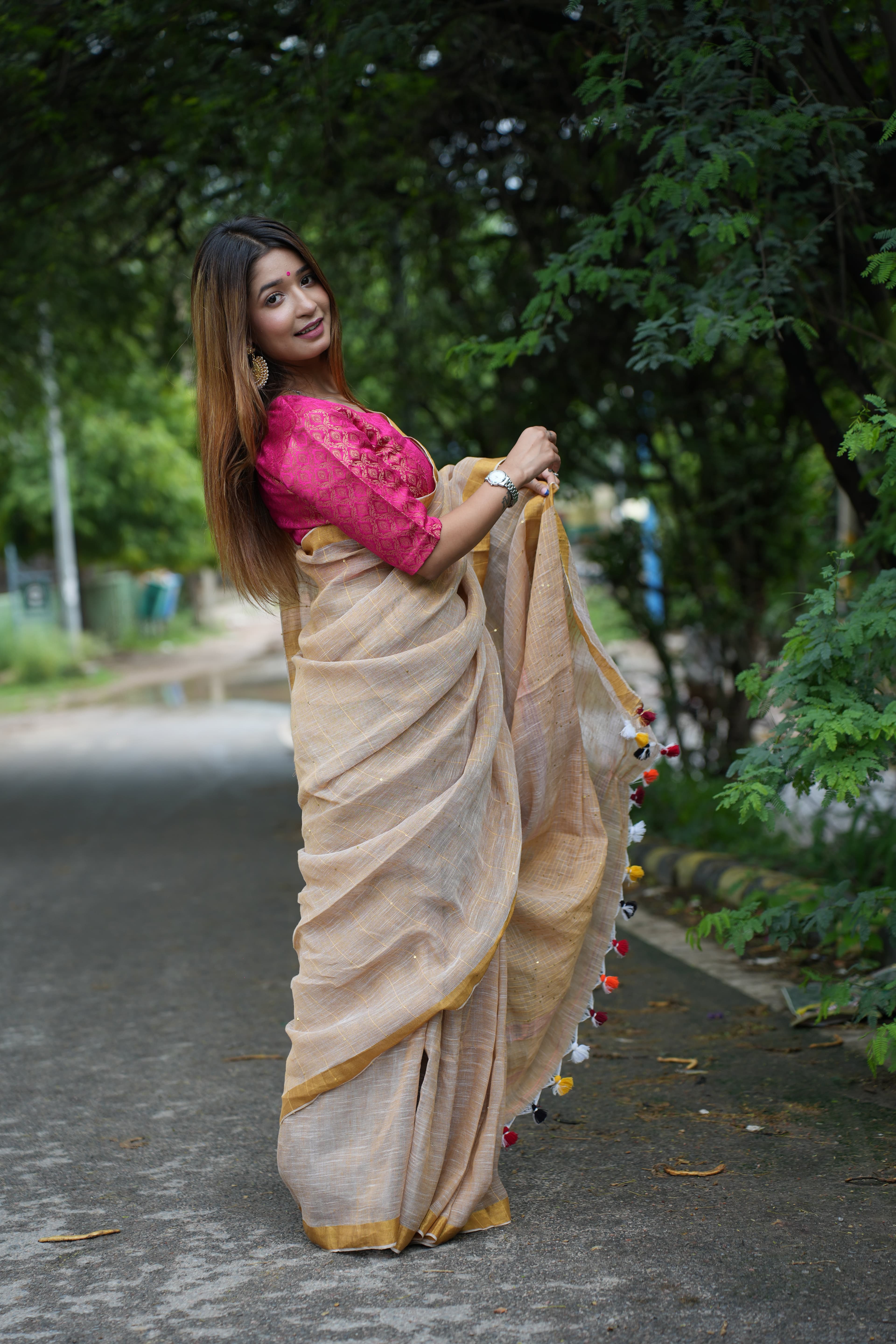 Woman in Purple Saree with Gold Border